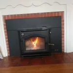 slightly off angled photo of wood burning fireplace