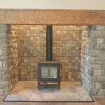 large fireplace alcove with wood burning stove within close up photo