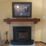 Pellet fireplace with photo over mantle