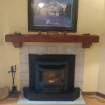 Pellet fireplace with photo over mantle close up