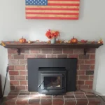 wood burning fireplace American flag over mantle