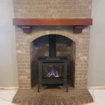 gas powered fireplace in brick alcove