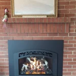 gas powered fireplace with brick background