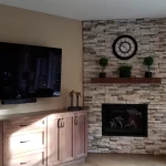 gas powered fireplace in corner of entertainment room