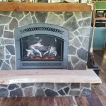 gas powered fireplace with bench attached close up