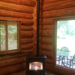 pellet fireplace in corner of cabin