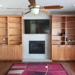 fireplace with full length bookcases surrounding before